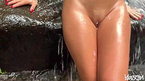Fucking passionately in the waterfall with big tits Asian