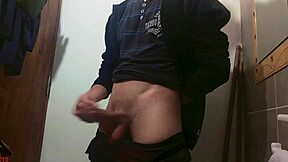 Skinny girl masturbates big cock in bathroom