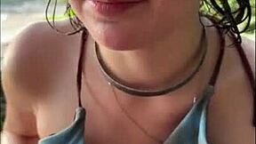 Horny teen in bikini gives oily titjob on public beach