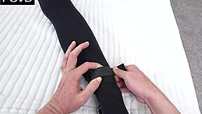 Naughty cum dump gets tied to the bed in bedroom bondage scene.