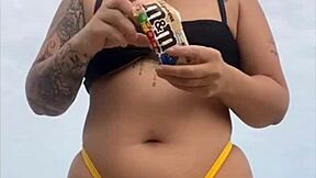 look at my swollen pussy in tight yellow bikini on beach