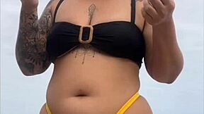 look at my swollen pussy in tight yellow bikini on beach