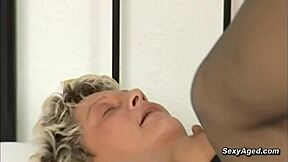 Blonde curvy granny in vintage lingerie gets fucked by young toyboy.