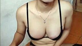 Young shemale strokes her big cock solo.