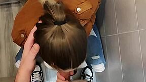 Hey, check this cute blonde with big tits giving a blowjob in university bathroom 😏