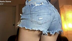 This fit body babe starts twerking and shaking her ass in mini denim shorts during solo homemade session