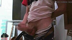 Skinny guy masturbates with big cock in shop backroom