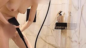 Bathing black-haired Japanese girl with ponytail and small tits