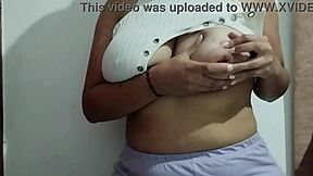 This milf indulges in massaging her big natural tits with real homemade pleasure, focusing on every sensual touch.