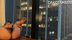 Chubby Dakota Marr squirting with butt plug and dildo in NYC skyscraper