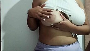 This milf indulges in massaging her big natural tits with real homemade pleasure, focusing on every sensual touch.