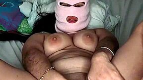 the sucia enmascarada brunette with big natural tits fingers her tight wet pussy in homemade solo play. she moans dirty talk while orgasming on webcam