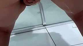 teen bent over squirting pee in bathroom