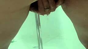 teen bent over squirting pee in bathroom