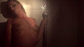 In a steamy shower scene, sexy blonde Dahlia indulges in naughty solo masturbation fun.