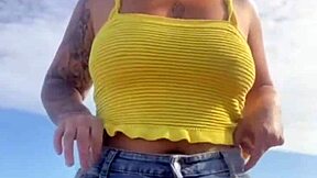 Hey, check out this young exhibitionist flashing her puffy pussy lips in bikini at the beach