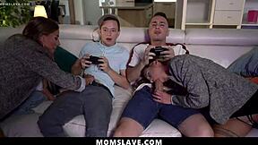 Sexy milfs eagerly ride their stepsons' cocks during intense gaming sessions, turning the room into a wild group scene