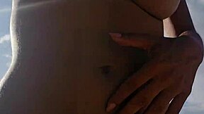 Amateur wife flashes big natural tits on nudist beach to strangers while her cuckold husband watches the exhibitionist fun.