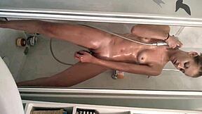 Isn't this sexy teen girl in the shower just irresistible with her brunette hair and shaved body?