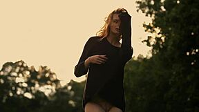 czech teen shows off her young tits in a glamorous outdoor wind-swept video scene