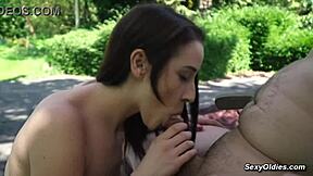 Teen neighbor teases old man into outdoor sex in his backyard garden.