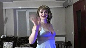 Sexy blonde milf and cute brunette virgin without panties in stockings paint toes on bed close up.