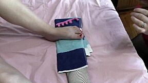 Sexy blonde milf and cute brunette virgin without panties in stockings paint toes on bed close up.