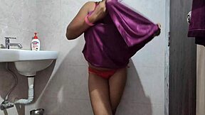 In this amateur video, a desi college girl carefully cleans her intimate area while bathing with clear voice instructions.