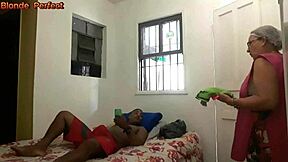 Amateur Brazilian mature milf in lingerie engages in interracial sex with her son's young friend after he catches her bathing and they can't resist the passionate encounter in the bedroom.