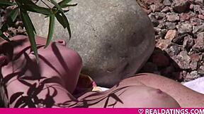 blonde teen masturbates outdoors with fingering