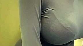 look at my milky tits, says the pregnant stepmother pulling them from her red bra