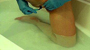 feel these rubber gloves on my shaved pussy lips while i shave everything smooth