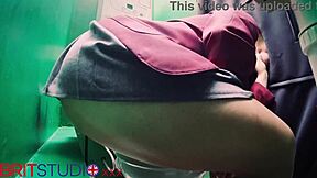 in a secretive booth, the young student encountered an anonymous encounter through the gloryhole, nervously exploring her first time with curiosity and hesitation