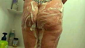Whoa, hidden cam catches this curvy bbw milf soaking wet in the shower, all candid and voyeur-style! 🚿😲