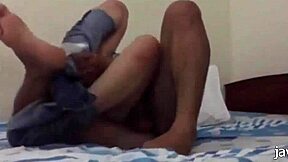 Vietnamese amateur porn shows asian milf with big tits studying at home in bed