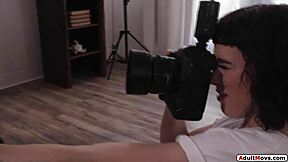 Busty brunette photographer straps on to fuck the petite model after kissing and fingering her wet pussy. Does she enjoy the intense strapon ride?