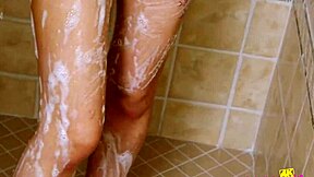 Intriguing contrast as sexy asian teen 18+ enjoys solo shower massage on sofa.