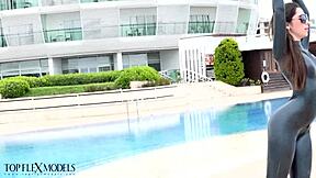 Latex flexi doll stretches in catsuit for outdoor fetish fun