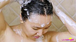 Intriguing contrast as sexy asian teen 18+ enjoys solo shower massage on sofa.