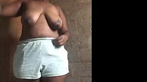 This young thick African teen with massive ass cheeks teases in a striptease session.