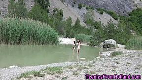 Teen lesbo fingers her friend's vag in outdoor setting. They enjoy the intimate moment together.