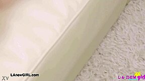 Attractive young woman poses to display her elegant figure during a casual photoshoot session