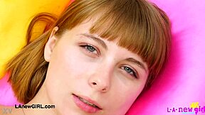 Attractive young woman poses to display her elegant figure during a casual photoshoot session