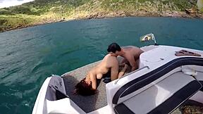 Vamos passear de barco turns into a wild adventure with a redhead teen and her big natural tits. She takes a big cock in her pussy for intense action.
