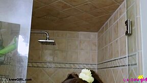 Sweet brunette beauty takes a shower on the sofa