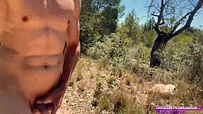 muscular stud strokes huge cock naked on public trail
