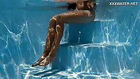 Skinny Hungarian teen Lana swims pool underwater showing juicy ass and small tits