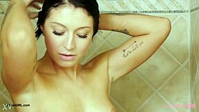 brunette fashion model steps into steamy shower after photoshoot