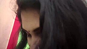 In a cozy bedroom, the cute young Indian couple shares sweet kisses and tender romantic moments together as loving husband and beautiful housewife.