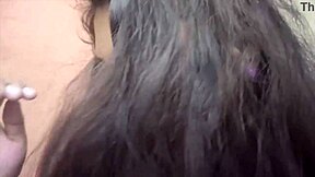 In a cozy bedroom, the cute young Indian couple shares sweet kisses and tender romantic moments together as loving husband and beautiful housewife.